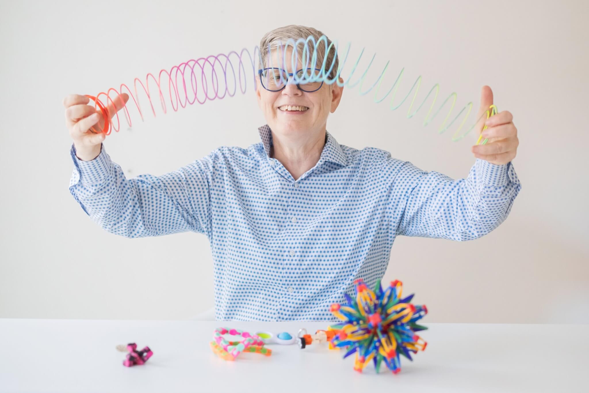 Picture of Wendy McGuire with Logo behind her
